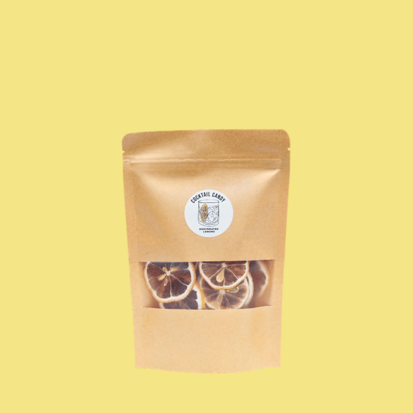 Kraft paper packaging with dried lemon slices on a yellow background