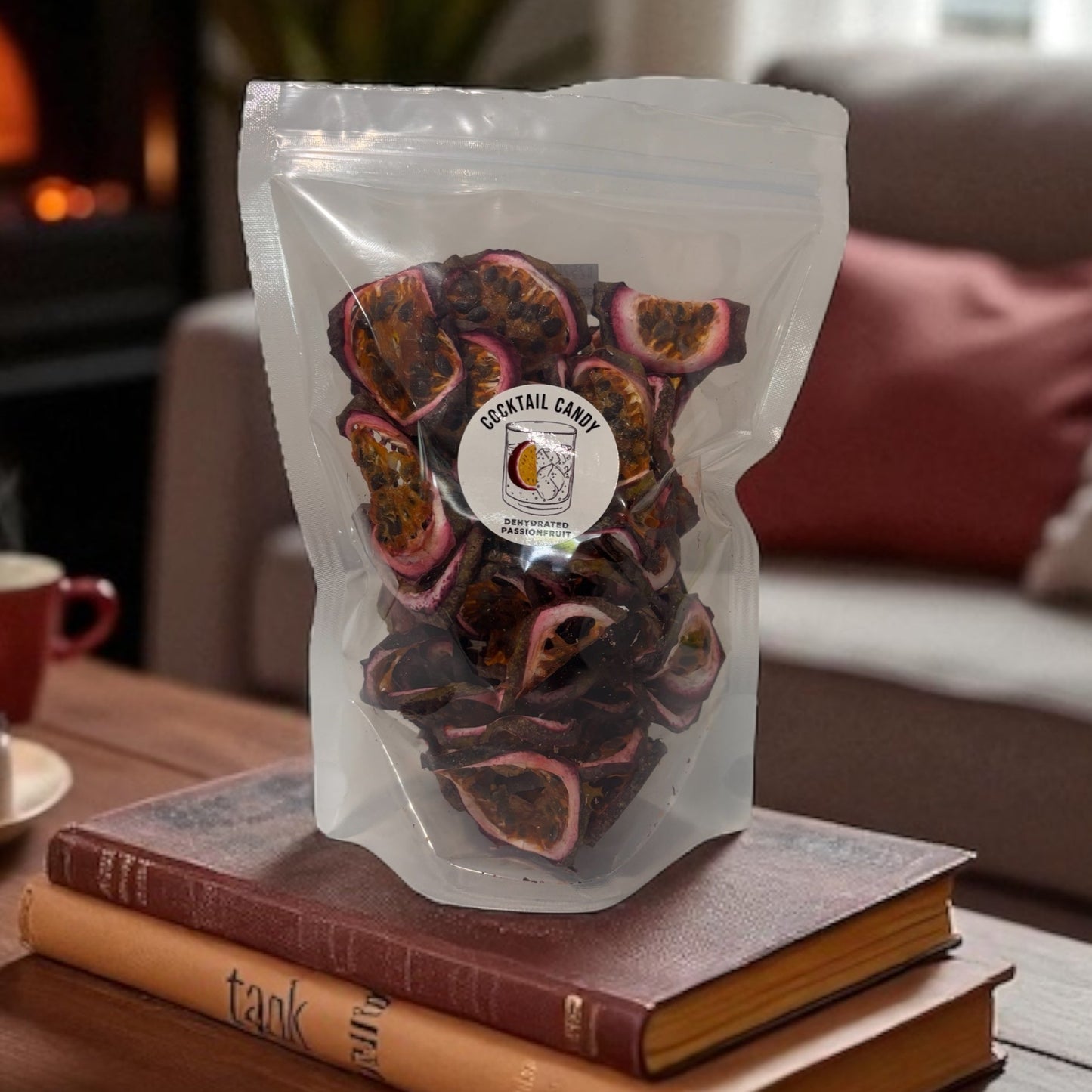 Bag of dried fruit on a stack of books with a cozy living room background