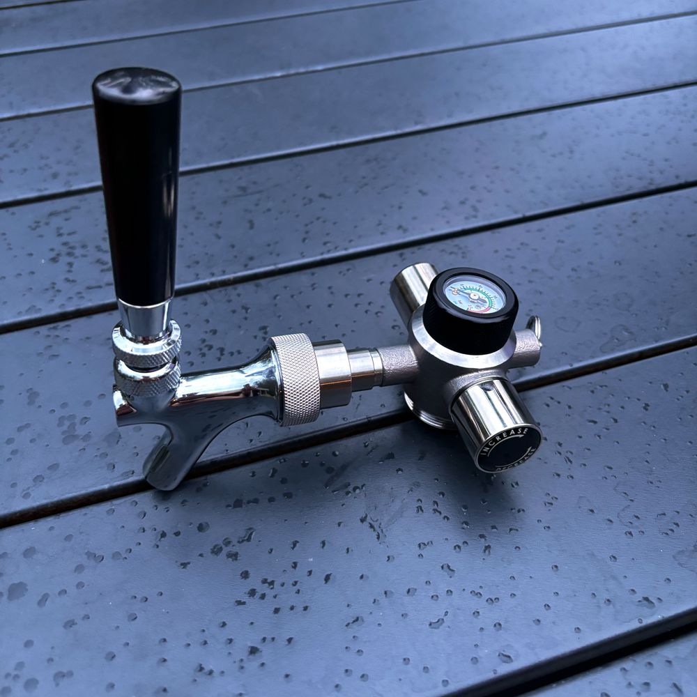 Close-up of the Mini Keg's stainless steel regulator and beer tap